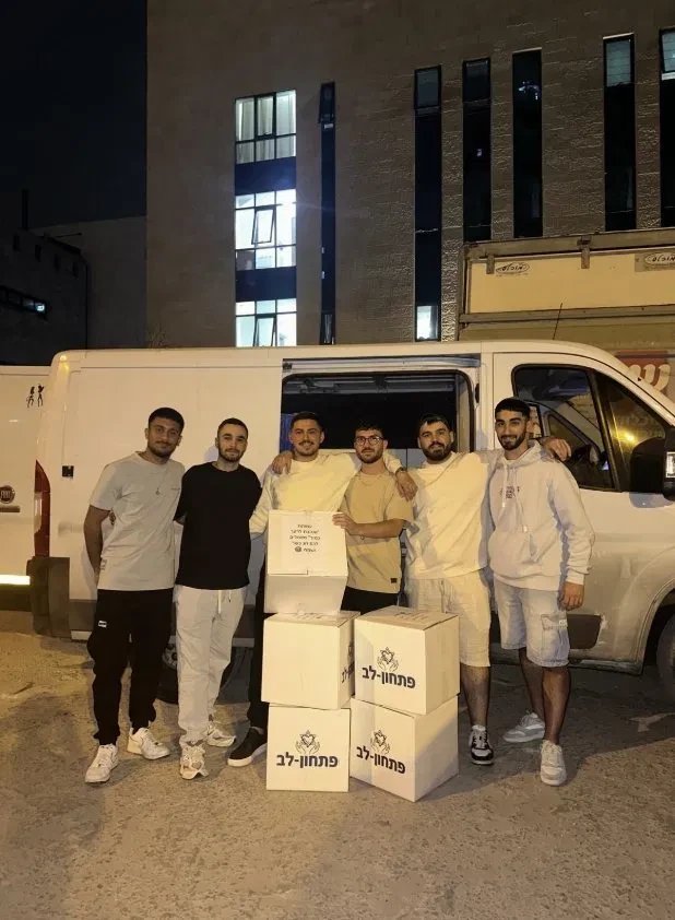 Roni and friends with food boxes on a volunteering night